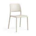 Chaise de salle à manger beige en polypropylène avec dossier ajouré 80 x 45 x 52 cm